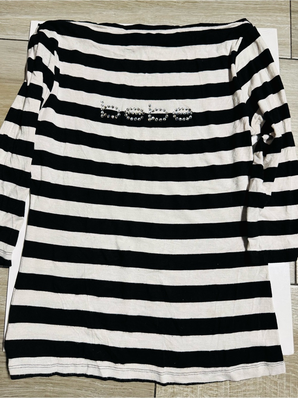 BEBE woman’s Black and White Striped off should sleeve with Embellished
